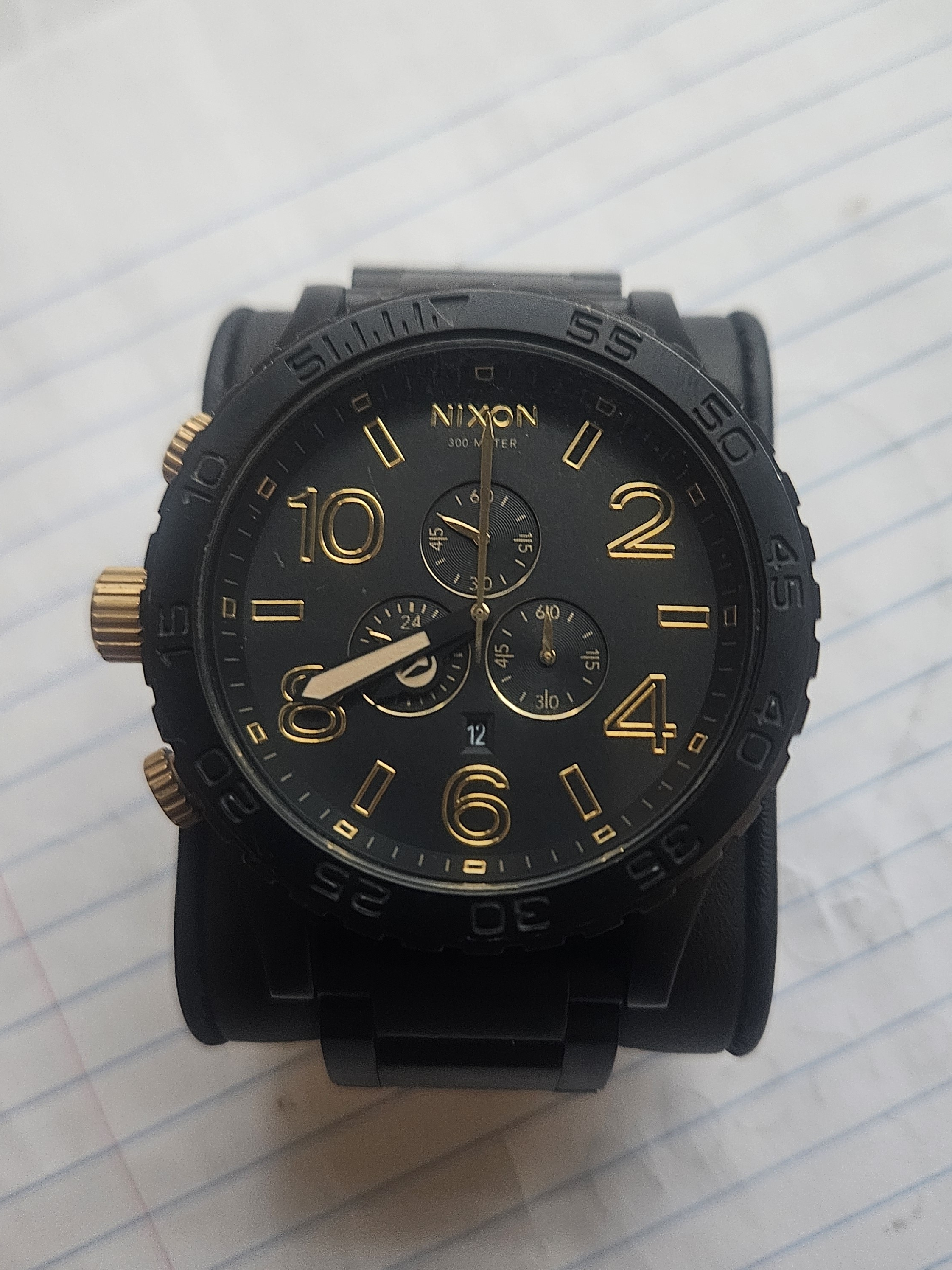 Nixon Black And Gold Chronograph Watch